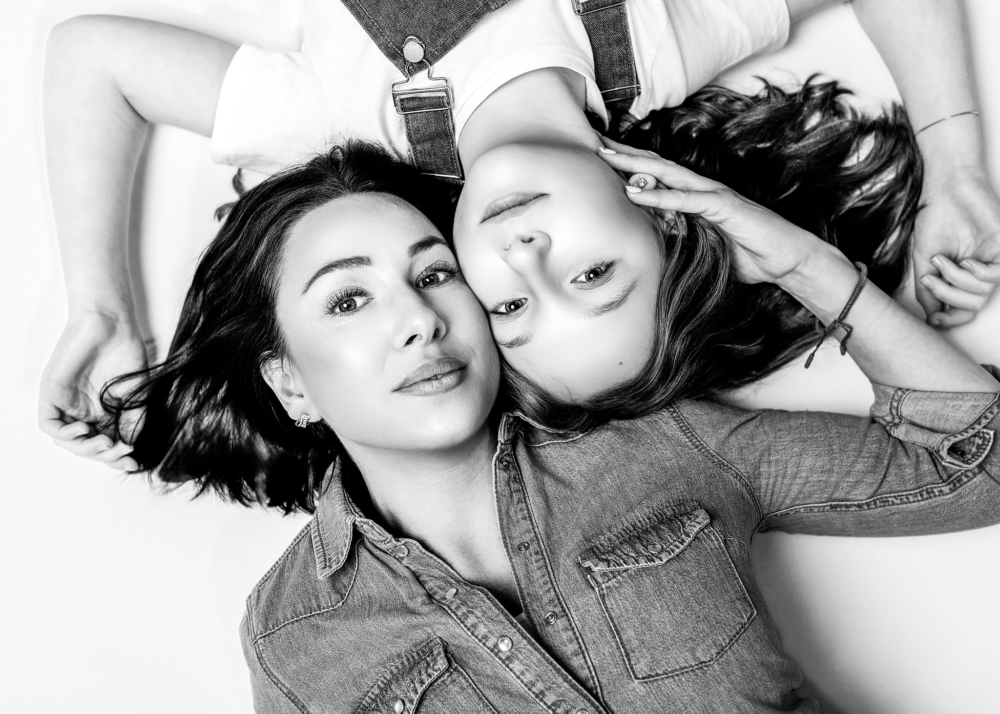 Black and white Mother and Me portrait showing a close connection between mum and daughter