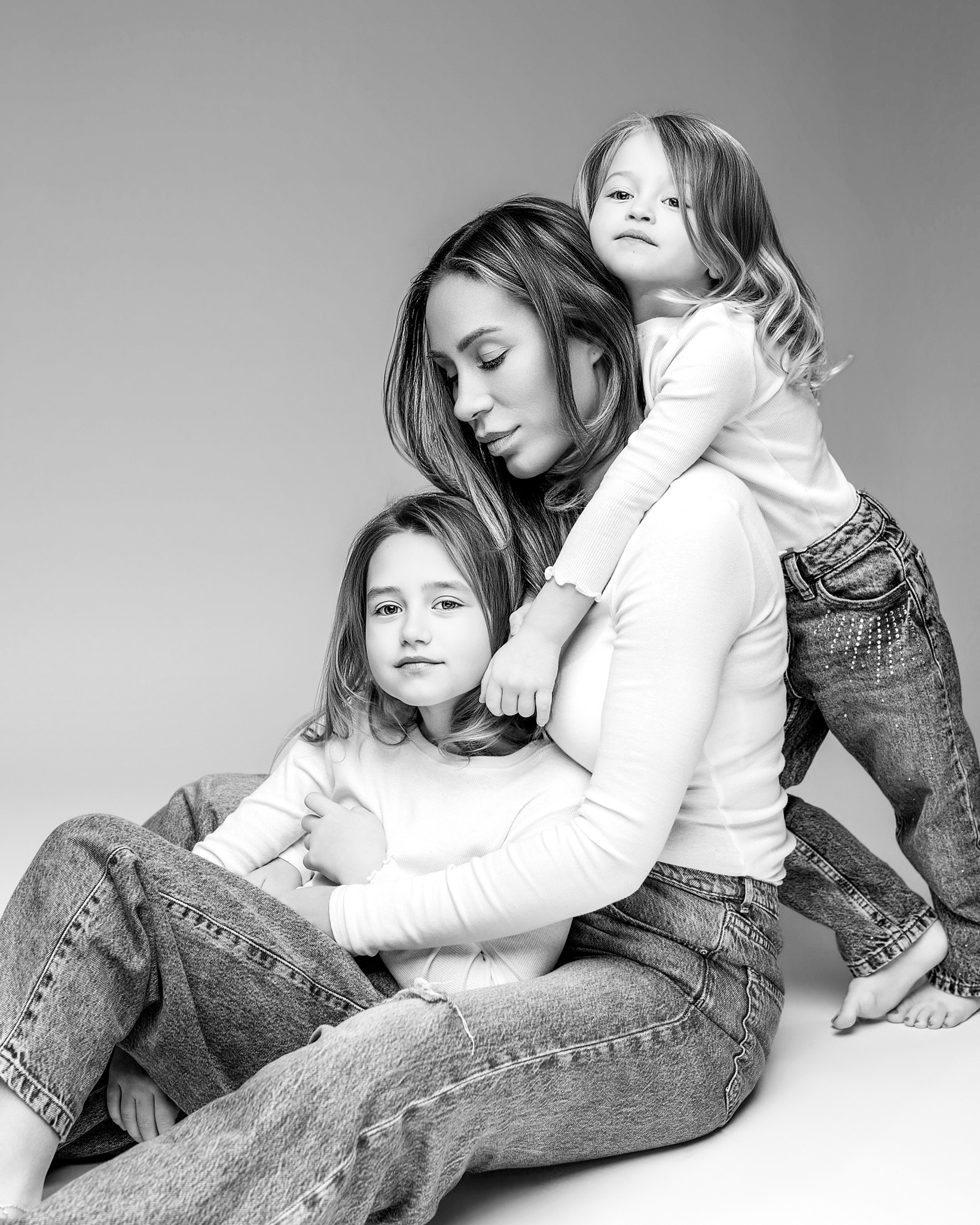 Black and white portrait of a mother with her two daughters