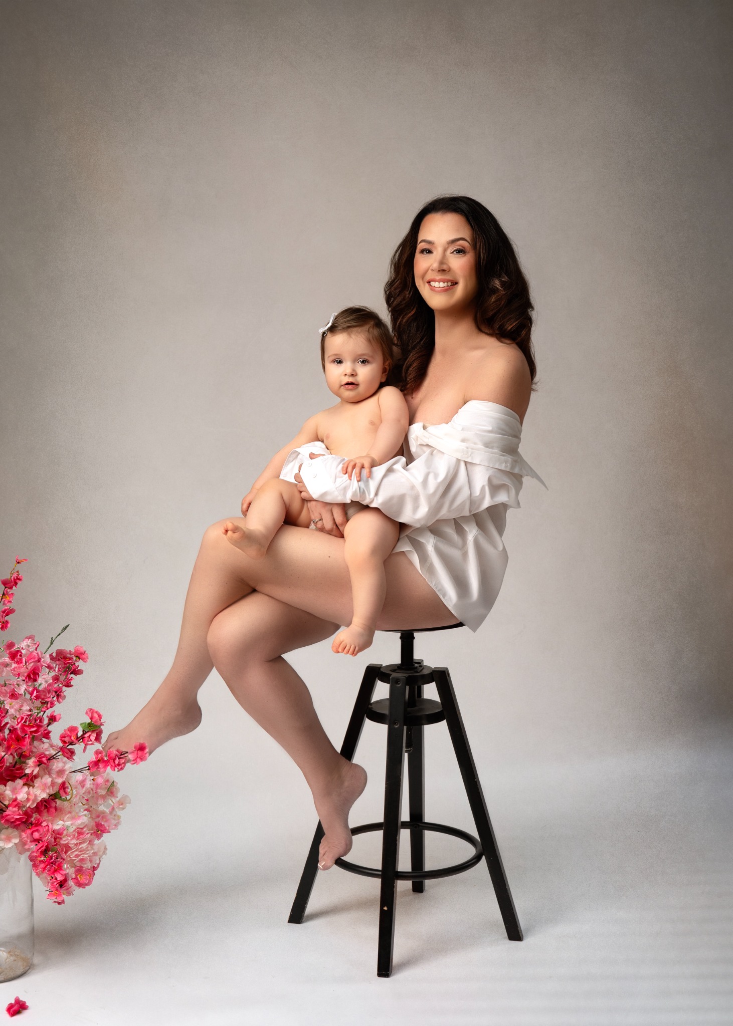 Mother and young daughter photographed together in the studio