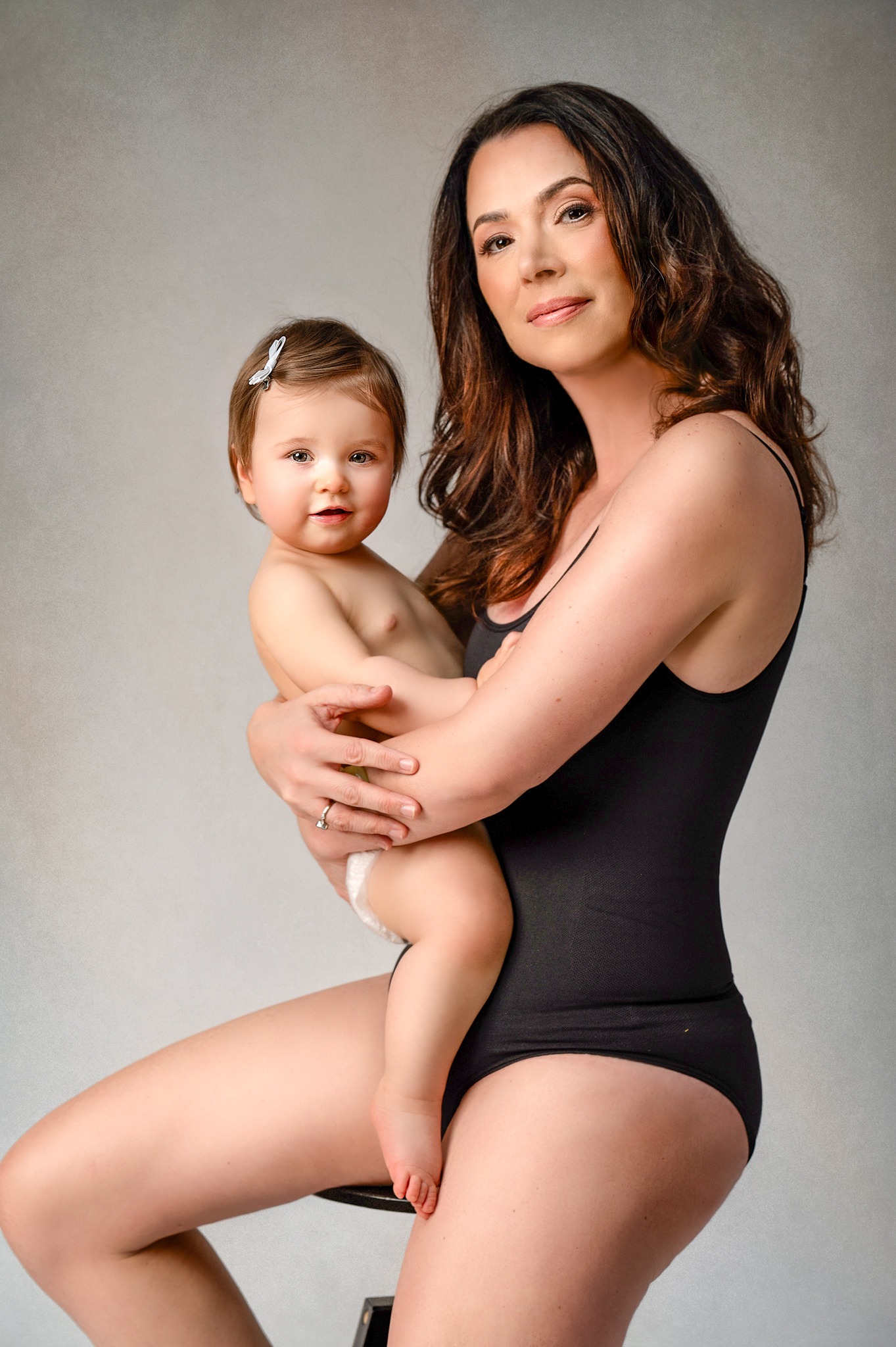 Mother holding her baby during a Mother and Me photography session