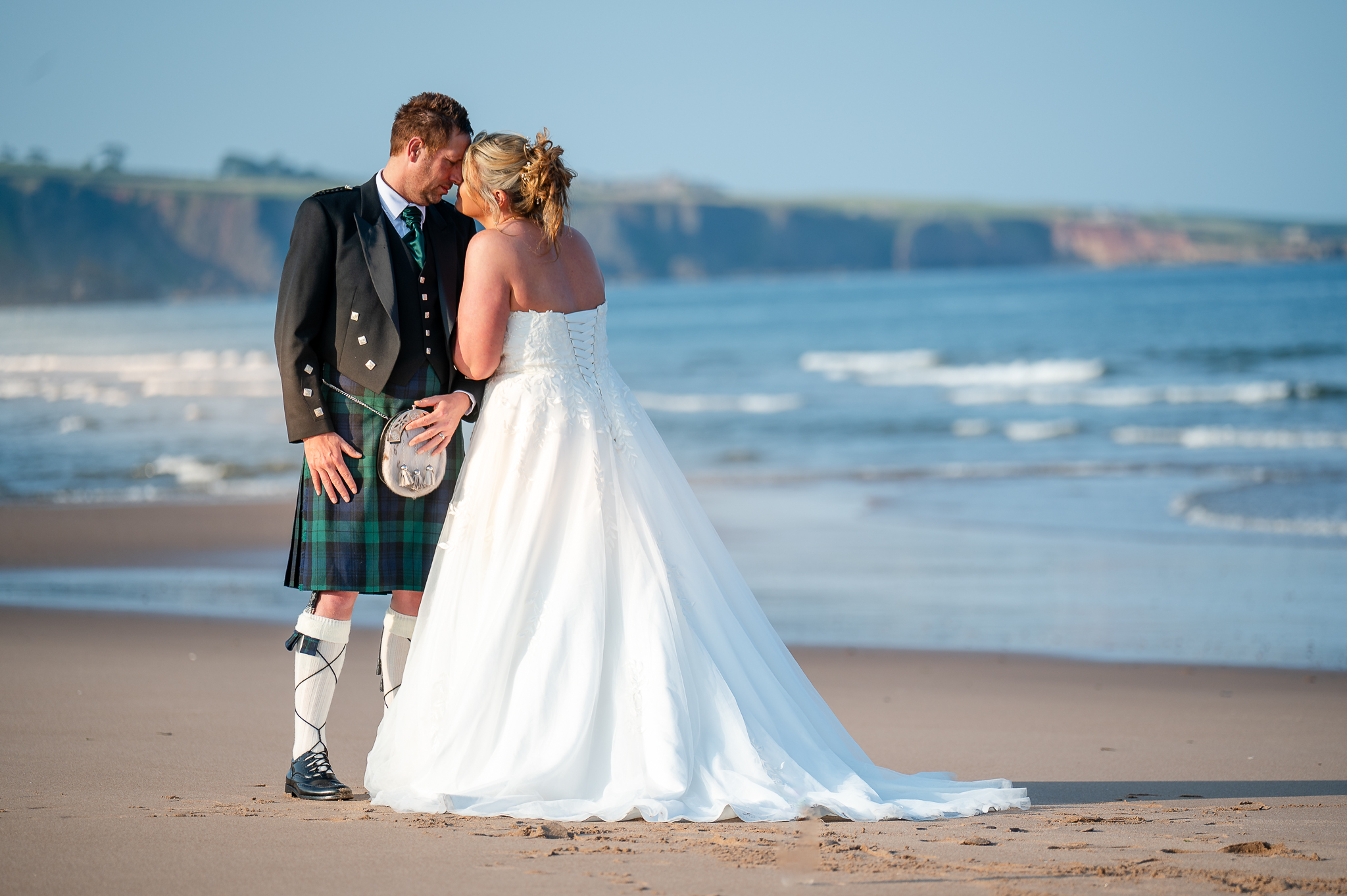 Bride and groom on a Scottish beach